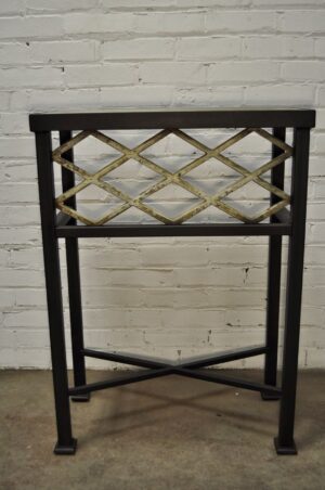 Custom iron console table by Ferro Designs LLC with a dark iron base and a tile top.