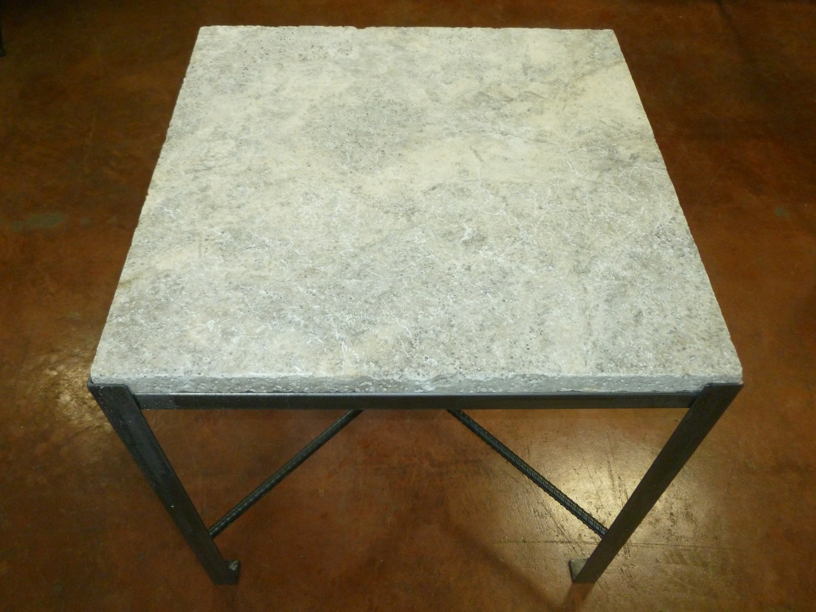 Ferro Designs LLC custom iron coffee table with a steel finish and a travertine tile top.