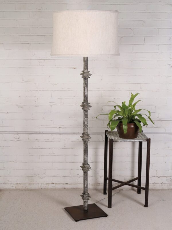 Custom iron floor lamp with a gray, distressed finish and a dark iron base. Paired with a 19 inch linen drum lamp shade.