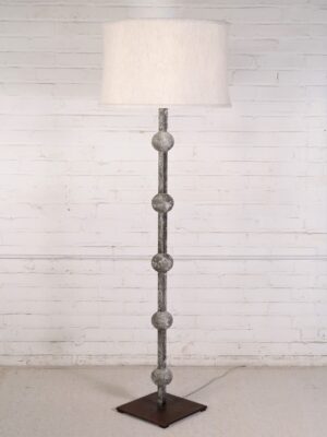 Custom iron floor lamp with a gray, distressed finish and a dark iron base. Paired with a 19 inch linen drum lamp shade.