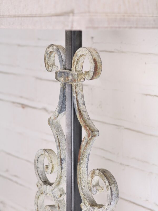 Scroll custom iron table lamp with a white, distressed finish