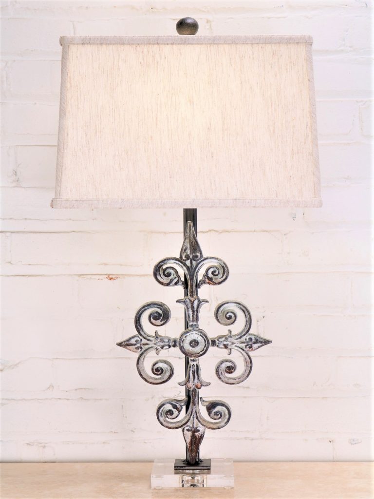 Cross custom iron table lamp with a white, distressed finish on an acrylic base