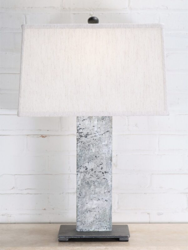 27 inch tall rectangle post custom iron table lamp with a white distressed finish and a dark iron base. Paired with a 15 inch rectangle linen lamp shade.