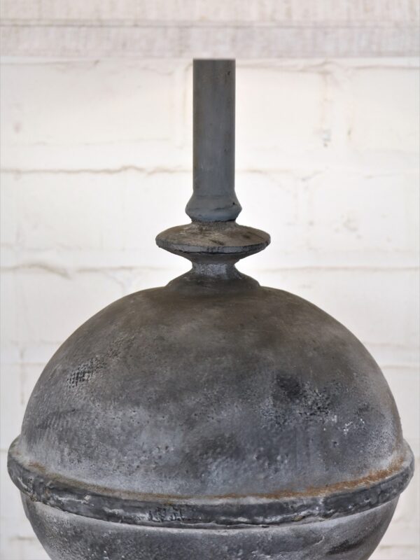 Finial custom iron table lamp with a gray, distressed finish.