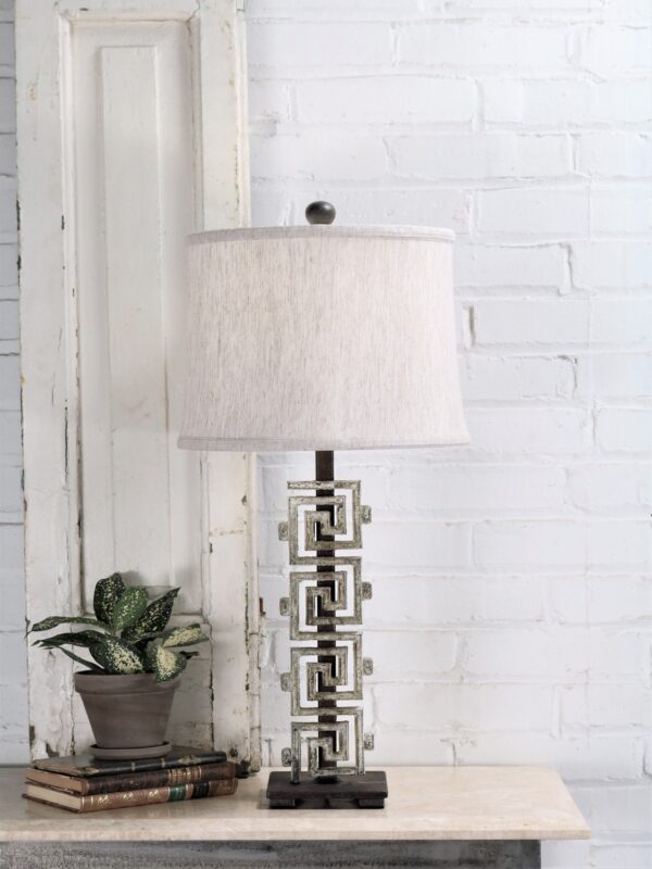Meandros-greek key custom iron table lamp with a white, distressed finish and a dark iron base. Paired with a 12 inch drum linen lamp shade.
