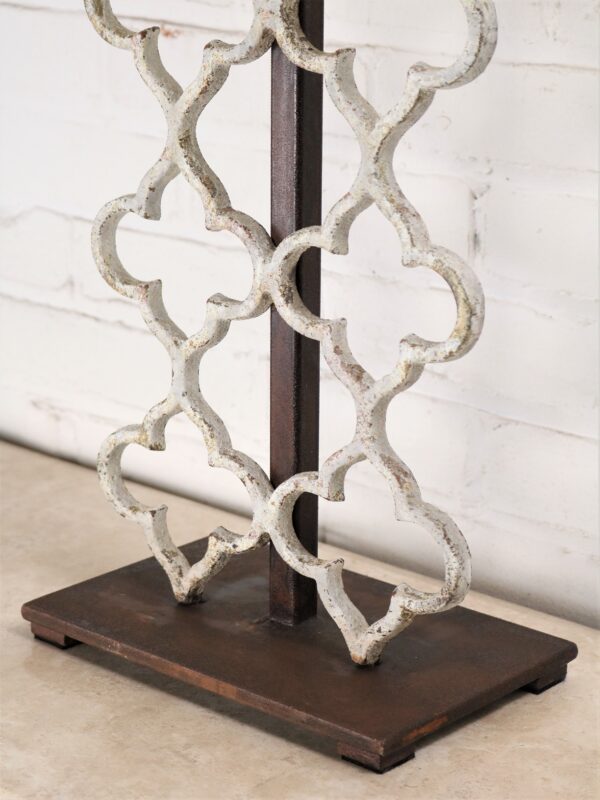 Quatrefoil custom iron table lamp with a white, distressed finish and a dark iron base.