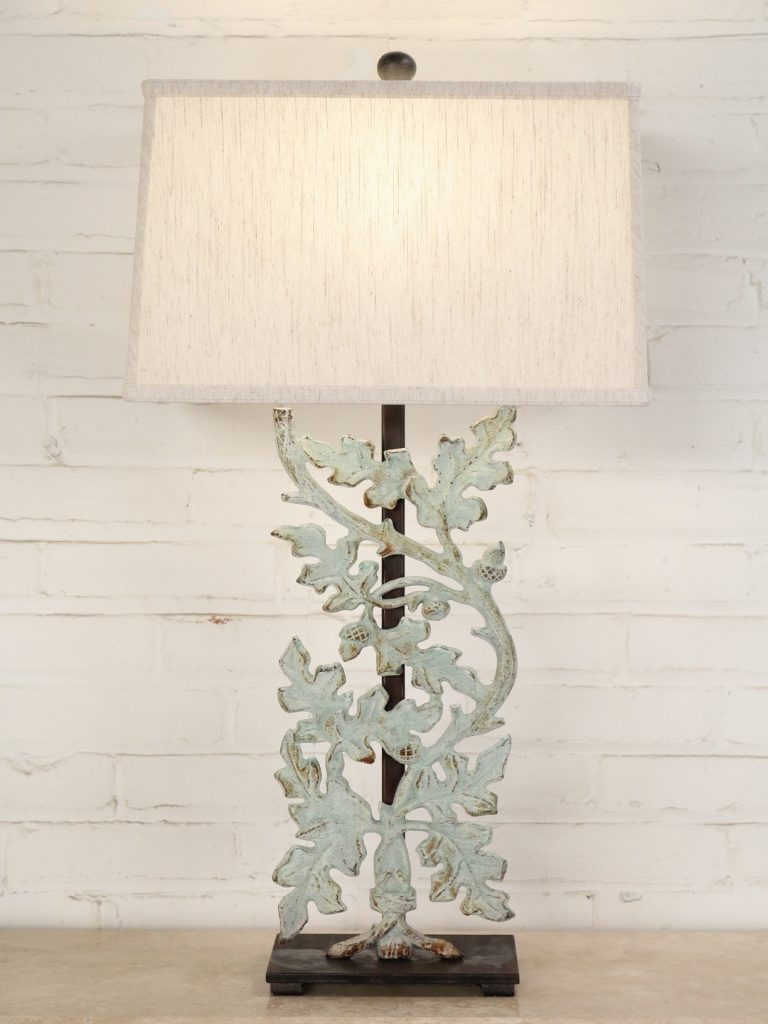 Oak leaves custom iron table lamp with a patina green finish and a dark iron base. Paired with a 16 inch rectangle linen lamp shade.