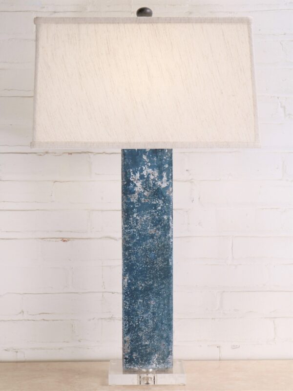 32 inch tall rectangle column custom iron table lamp with a blue, distressed finish and an acrylic base. Paired with a 17 inch rectangle linen lamp shade.