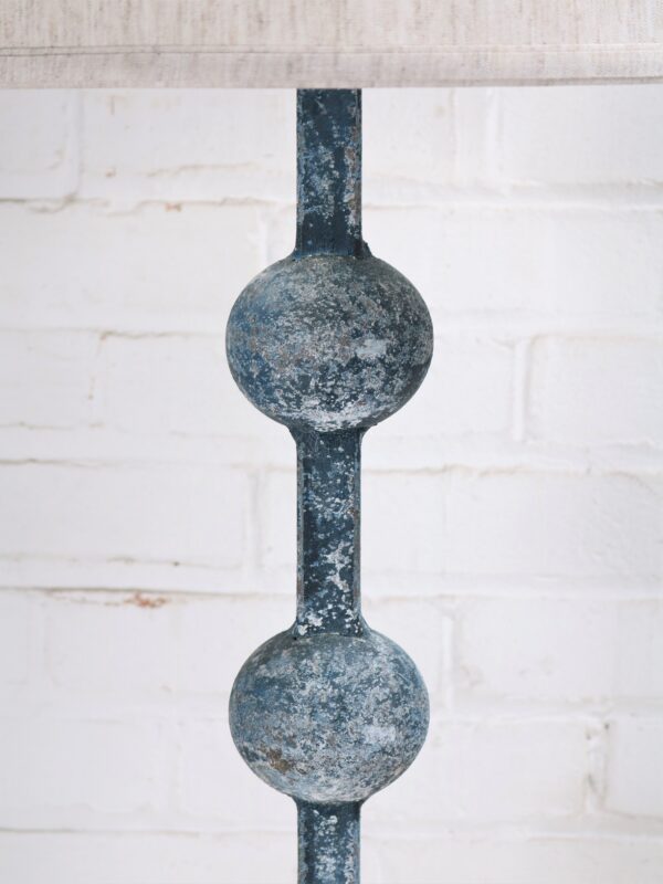 Sphere custom iron table lamp with a blue, distressed finish.