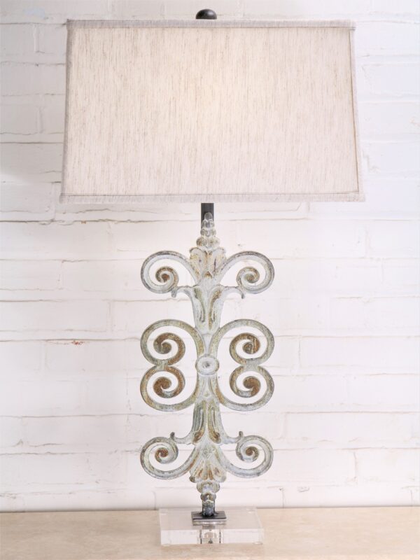 Fleur Scroll custom iron table lamp with a white, distressed finish and an acrylic base. Paired with a 17 inch rectangle linen lamp shade.