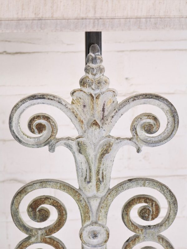 Fleur Scroll custom iron table lamp with a white, distressed finish.