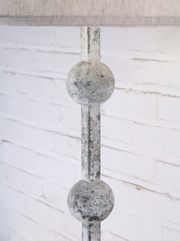 Spheres custom iron floor lamp with a white, distressed finish.