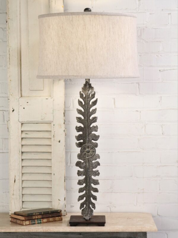 Large leaf custom iron table lamp with a gray, distressed finish and a dark iron base. Paired with a 19 inch linen drum lamp shade.