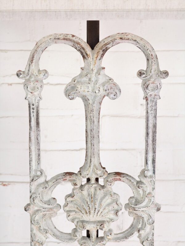 Shell custom iron table lamp with a white, distressed finish.