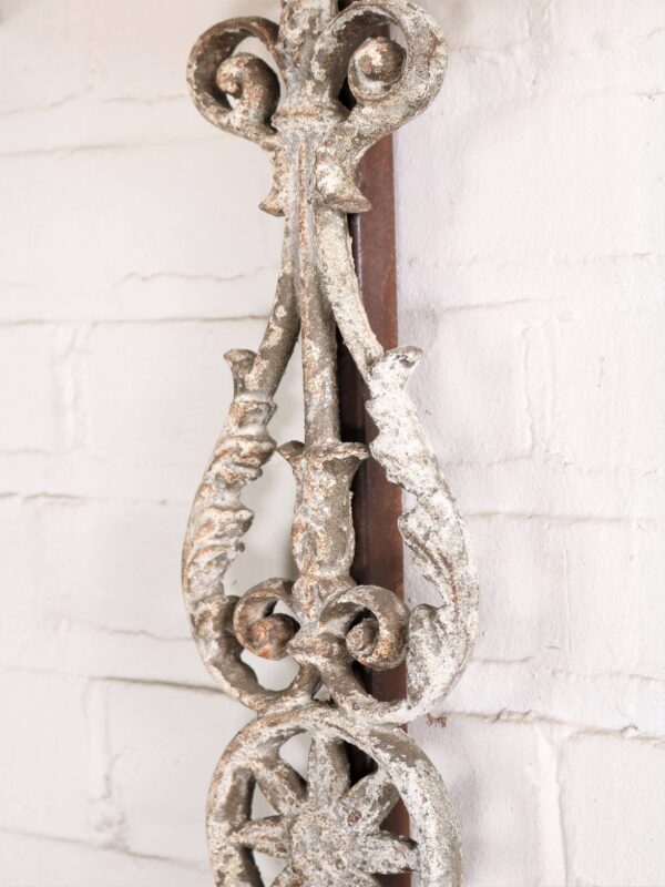 Spanish style custom iron wall sconce with a white, distressed finish.