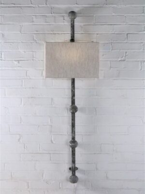 Spheres custom iron wall sconce with a gray, distressed finish. Paired with a half rectangle linen lamp shade.