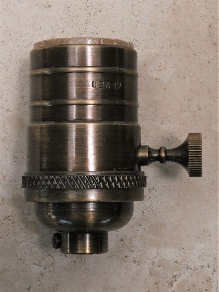 Replacement lamp socket in dark bronze.