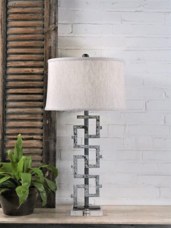Antique iron table lamp by Ferro Designs LLC with a white, distressed finish and an acrylic base. Paired with a 15 inch linen drum lamp shade.