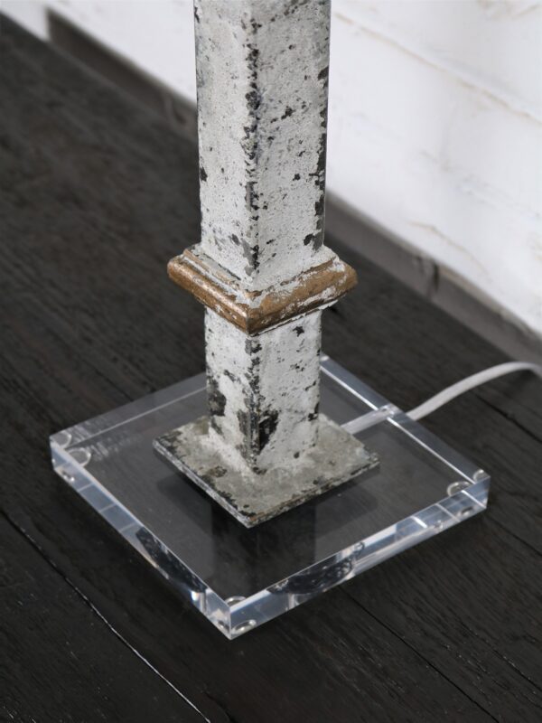 White metal table lamp with gold accents and an acrylic base.